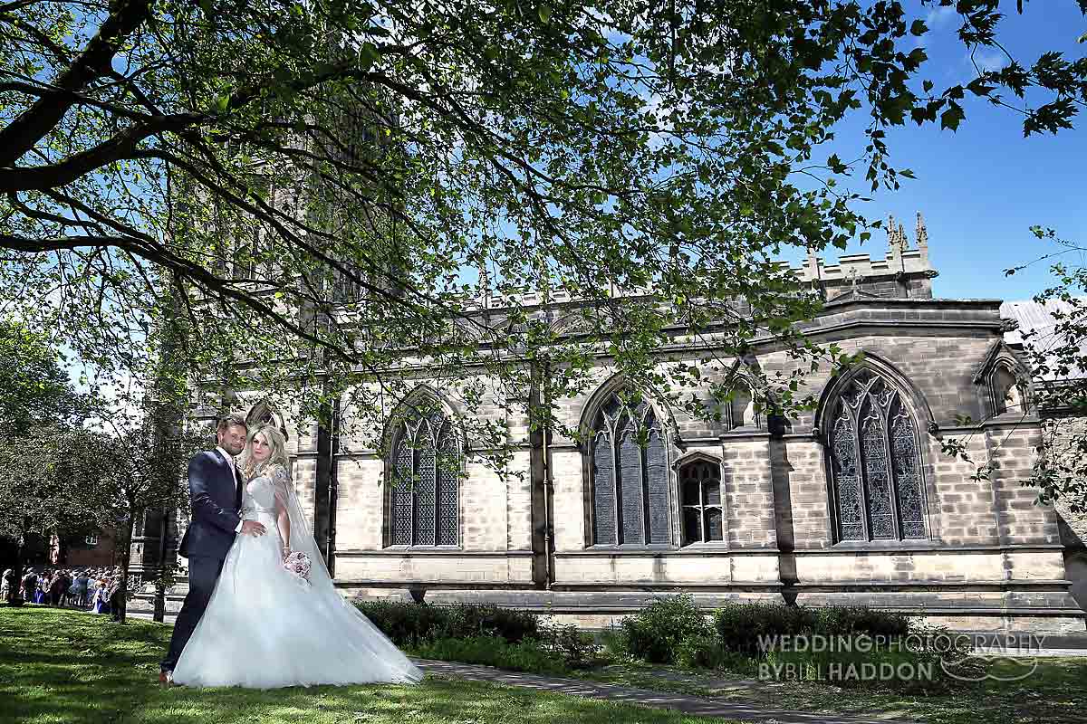 bride and groom outside All Saints with Holy Trinity Church Loughborough