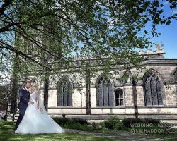 All Saints with Holy Trinity Church with bride and groom bride and groom outside All Saints with Holy Trinity Church Loughborough